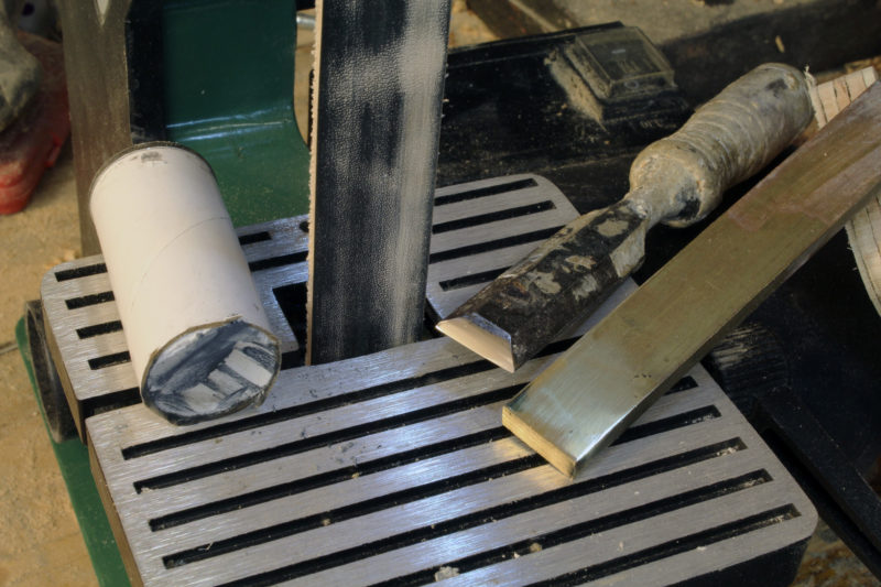 One assortment of belts for sharpening included a leather strop and buffing compound.