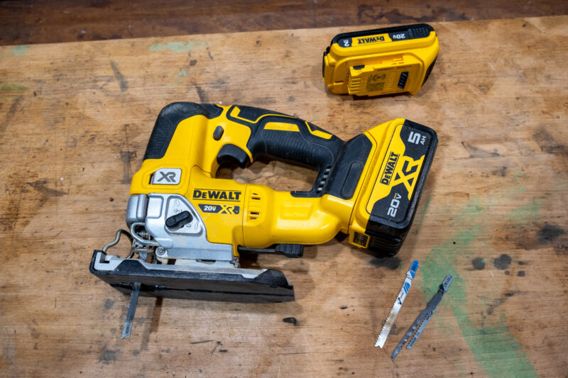 DeWalt jigsaw with spare battery and blades