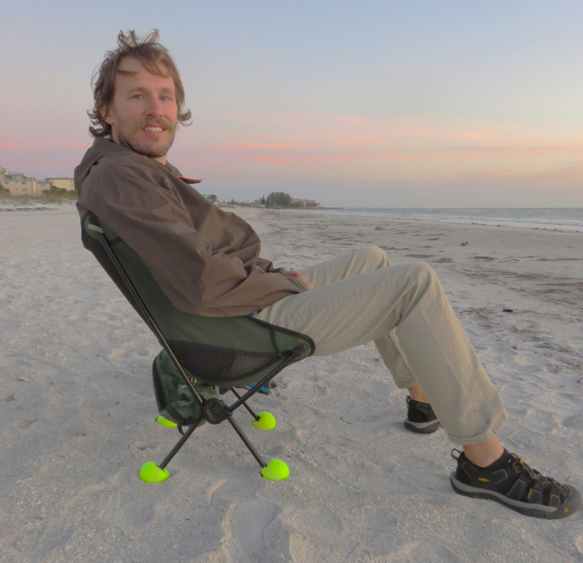 Four tennis balls slit to fit over the chair's feet keep them from sinking into sand.