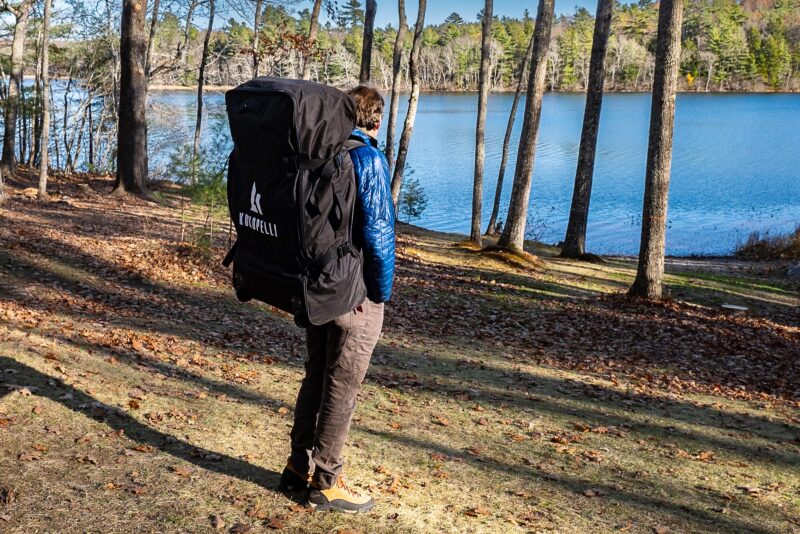 Man carrying a Kokopelli Platte-Plus kayak pack on his back.